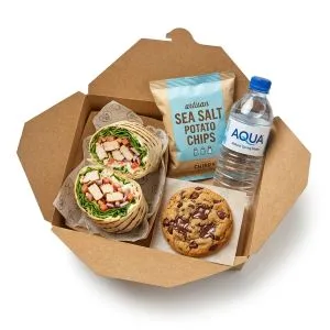 A Subway wrap with a side and a drink
